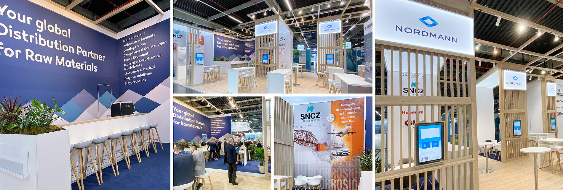 Der Messestand von Nordmann zeigt eine klare, strukturierte Gestaltung mit Holzelementen, Touchscreens und blauen Wandflächen mit Produktgruppen – Besucher stehen im Gespräch an Tischen und Theken.